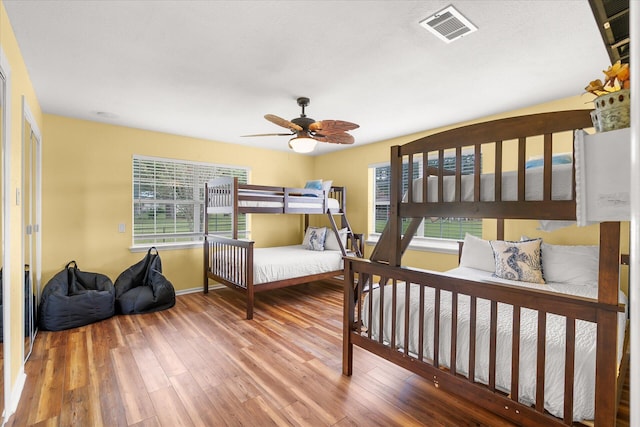 bedroom featuring wood-type flooring and ceiling fan