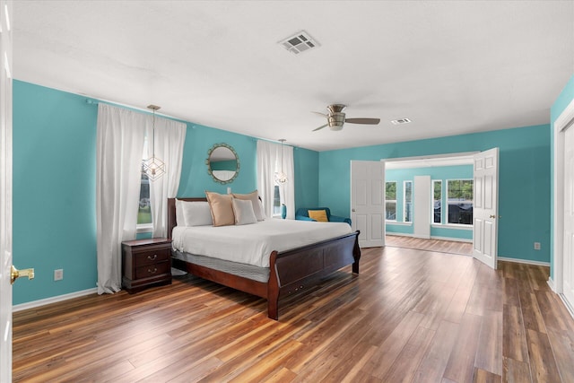 bedroom featuring ceiling fan and dark wood-type flooring