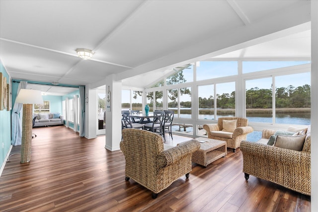 living room featuring floor to ceiling windows, vaulted ceiling with beams, dark hardwood / wood-style flooring, and a water view