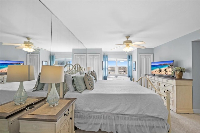 bedroom featuring light carpet and ceiling fan