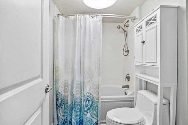 bathroom with toilet and shower / tub combo with curtain