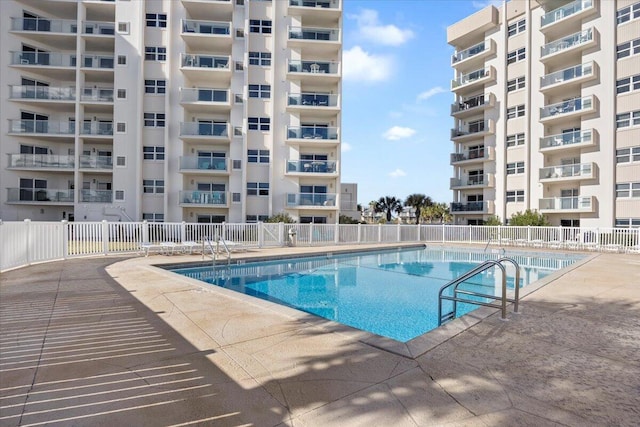 view of swimming pool with a patio