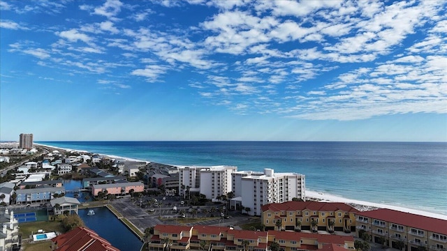 drone / aerial view featuring a water view and a beach view