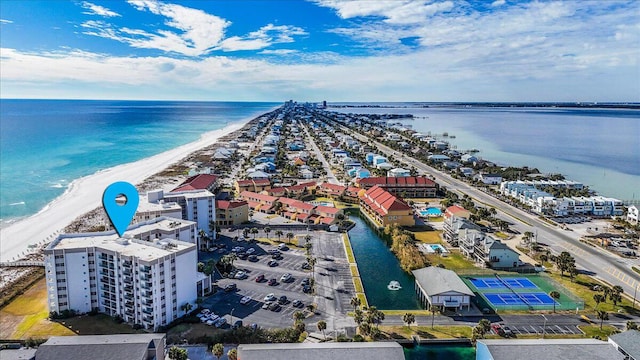 birds eye view of property with a beach view and a water view