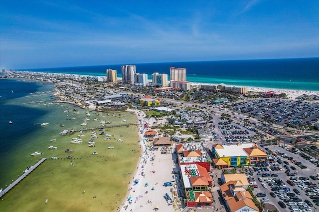 bird's eye view featuring a water view and a beach view