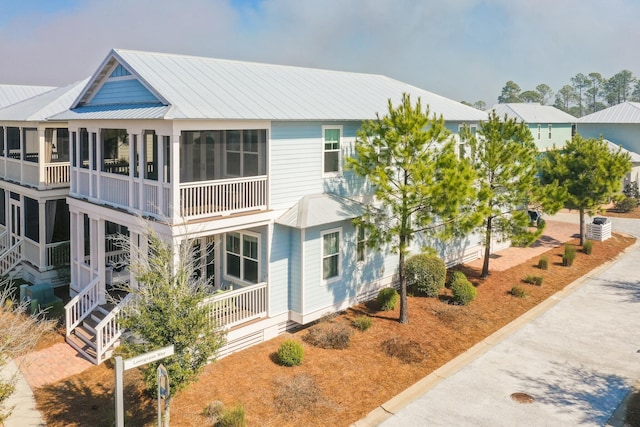 view of front of house with a sunroom