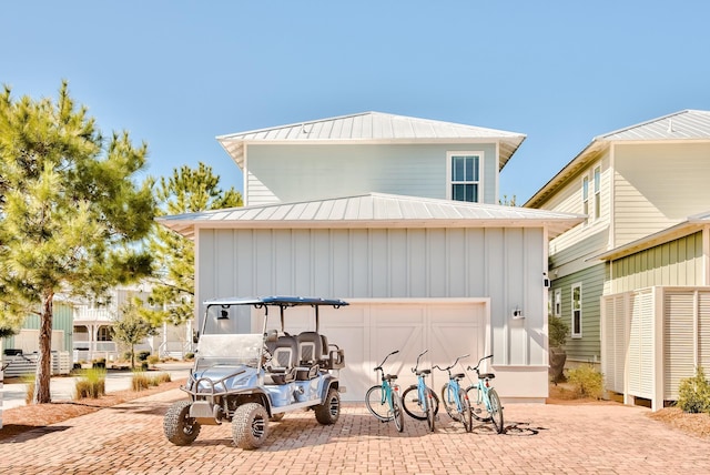 view of front of home featuring board and batten siding, a standing seam roof, and metal roof