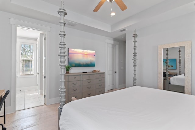 bedroom with light wood finished floors, visible vents, baseboards, connected bathroom, and recessed lighting