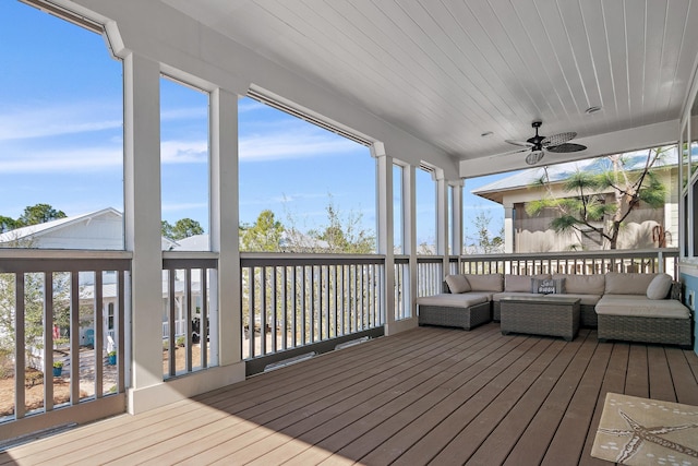 deck with a ceiling fan and outdoor lounge area