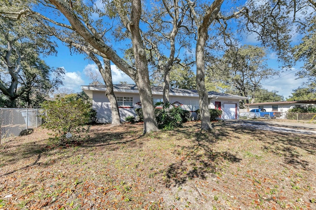 ranch-style home featuring a garage