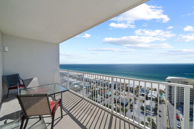 balcony with a view of the beach and a water view