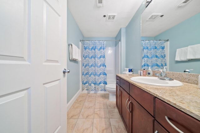 bathroom with vanity, toilet, and curtained shower