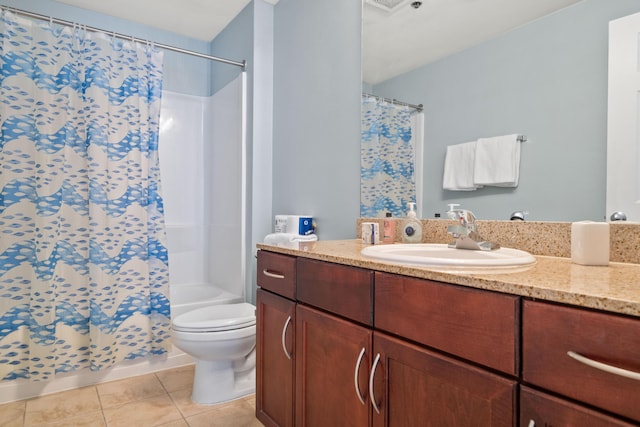 bathroom featuring tile patterned flooring, vanity, toilet, and curtained shower