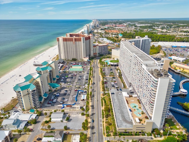 drone / aerial view featuring a water view and a beach view