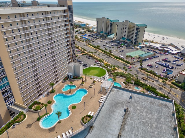 drone / aerial view with a view of the beach and a water view