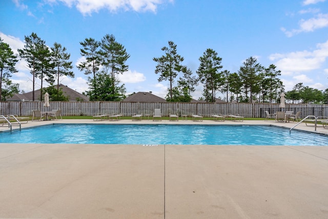 view of swimming pool with a patio area