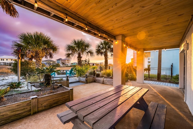 view of patio terrace at dusk