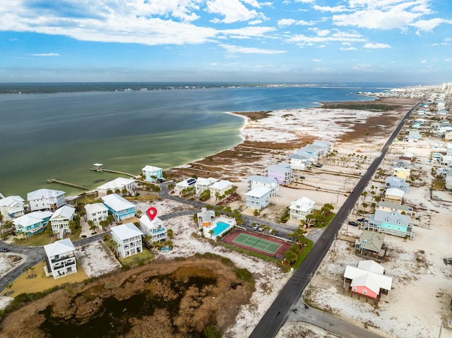 aerial view featuring a view of the beach and a water view