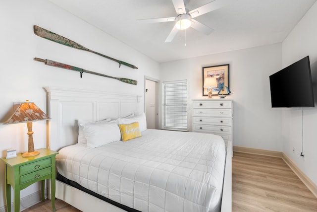 bedroom featuring ceiling fan and light hardwood / wood-style flooring