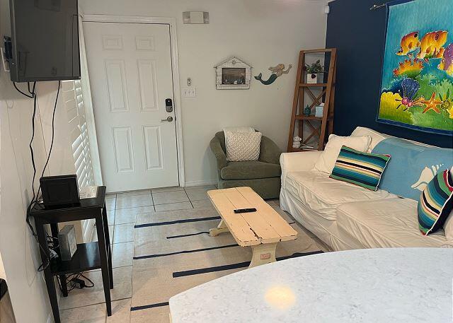 living room with light tile patterned floors