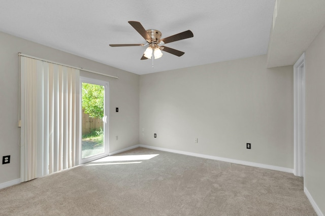 empty room with light colored carpet and ceiling fan