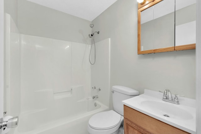 full bathroom featuring toilet, vanity, and bathtub / shower combination