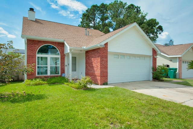 single story home with a front yard and a garage