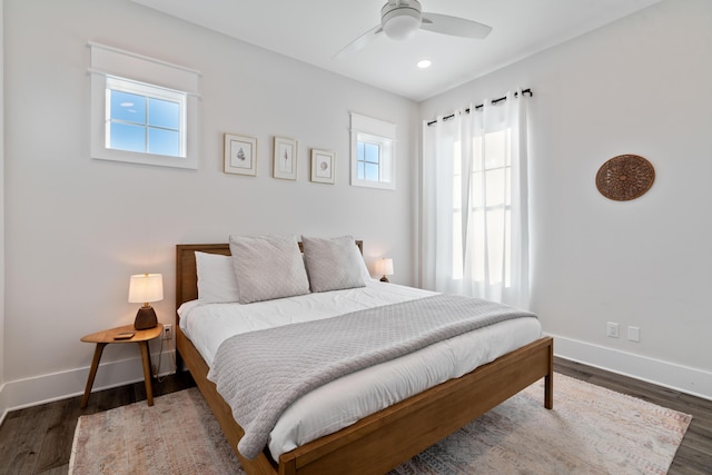 bedroom featuring ceiling fan and dark hardwood / wood-style floors