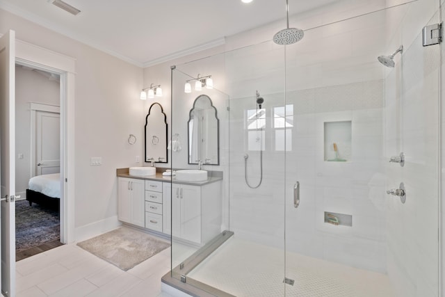 bathroom with vanity, ornamental molding, and a shower with door