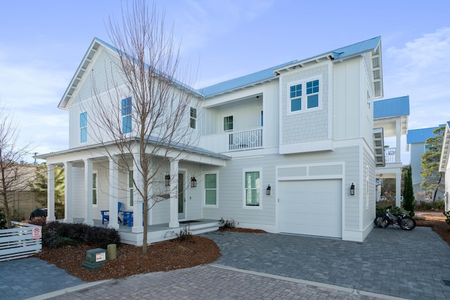 view of front of house with a balcony and a garage