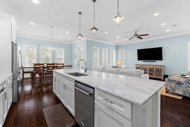 kitchen with sink, a center island with sink, white cabinetry, and appliances with stainless steel finishes