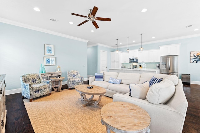 living room featuring ceiling fan, dark hardwood / wood-style flooring, and ornamental molding