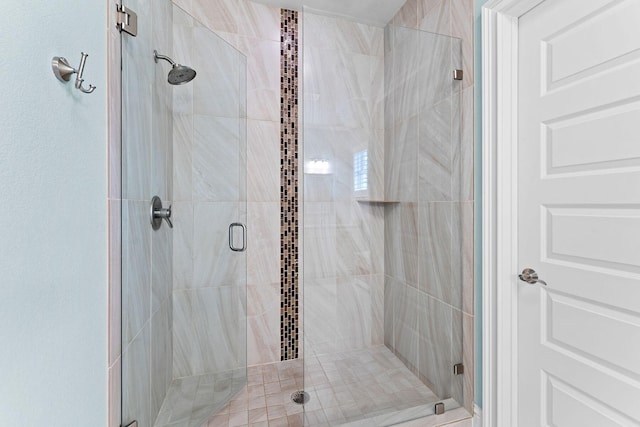 bathroom with a shower with shower door