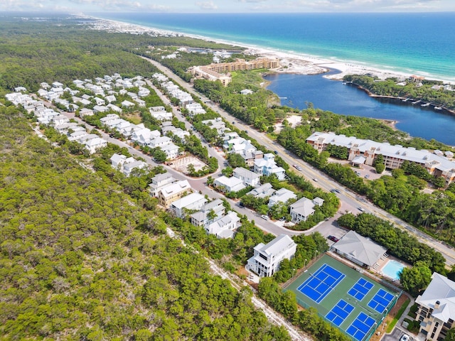 birds eye view of property with a beach view and a water view