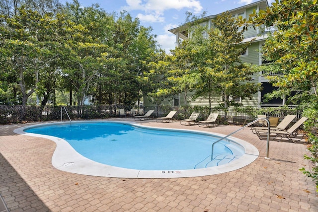 view of pool featuring a patio area