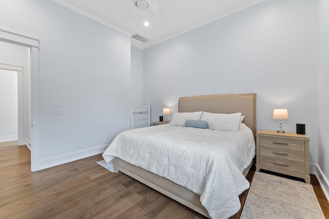 bedroom with dark hardwood / wood-style flooring