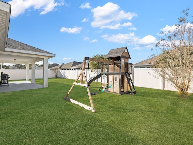 view of play area featuring a patio area and a yard