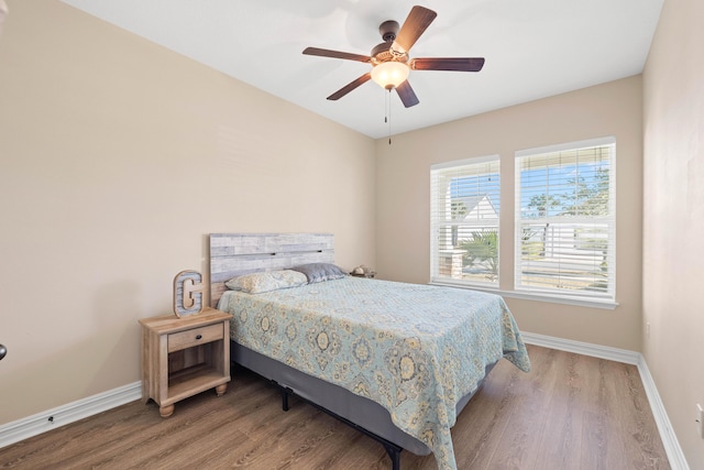 bedroom with ceiling fan and hardwood / wood-style floors