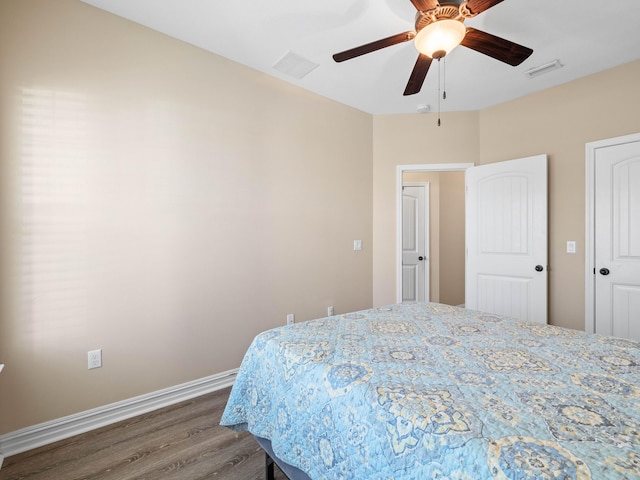 bedroom with ceiling fan and hardwood / wood-style floors