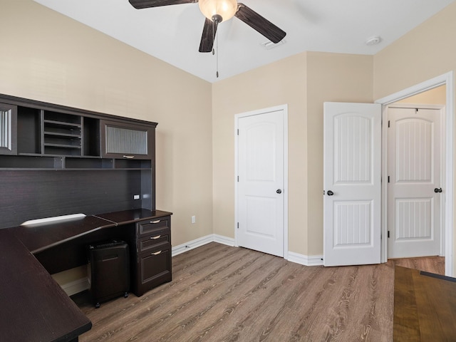 office featuring hardwood / wood-style flooring and ceiling fan