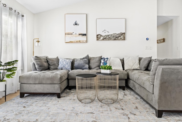 tiled living room with lofted ceiling