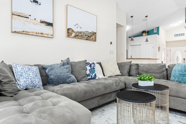 living room featuring vaulted ceiling