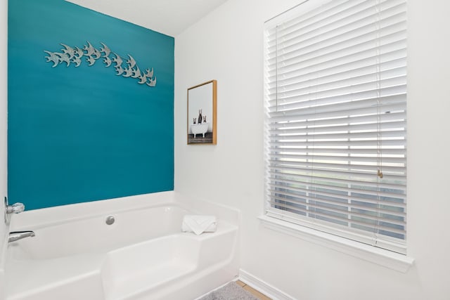 bathroom with a tub