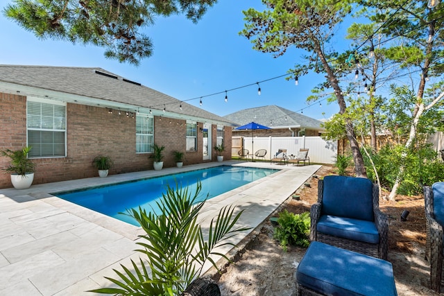 view of swimming pool with a patio