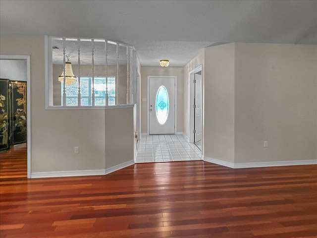 entryway with hardwood / wood-style flooring