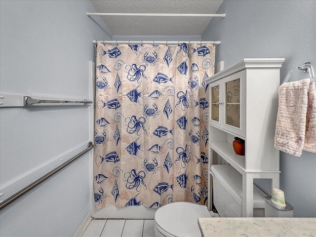 bathroom featuring toilet, a textured ceiling, tile patterned floors, and shower / tub combo with curtain