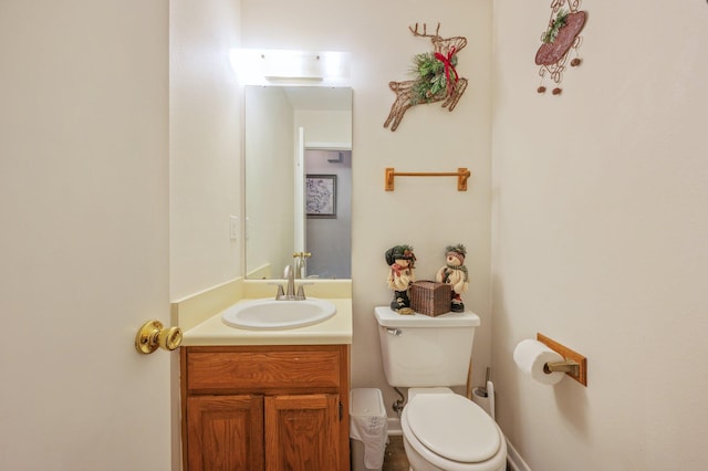 bathroom with toilet and vanity