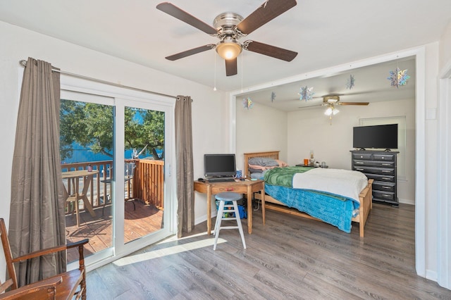 bedroom featuring ceiling fan, wood-type flooring, and access to outside