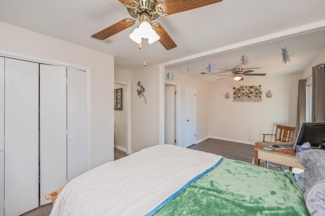 bedroom featuring ceiling fan and dark wood-type flooring