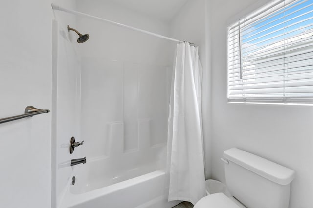 bathroom featuring toilet and shower / bathtub combination with curtain